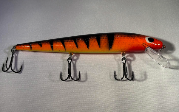 0ld orange color split wood fishing lure with treble hook BIM Tackle Shallow Cruiser Bucktail Castor Major With a slight exaggeration of the unique Rapala baitfish in distress swimming action Have you made the